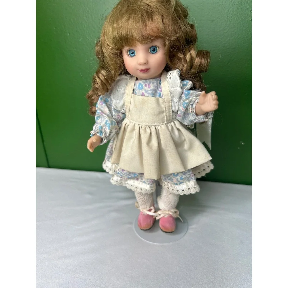 Vintage Porcelain Collector Doll Blue Eyes Floral Dress Cream Apron with Stand